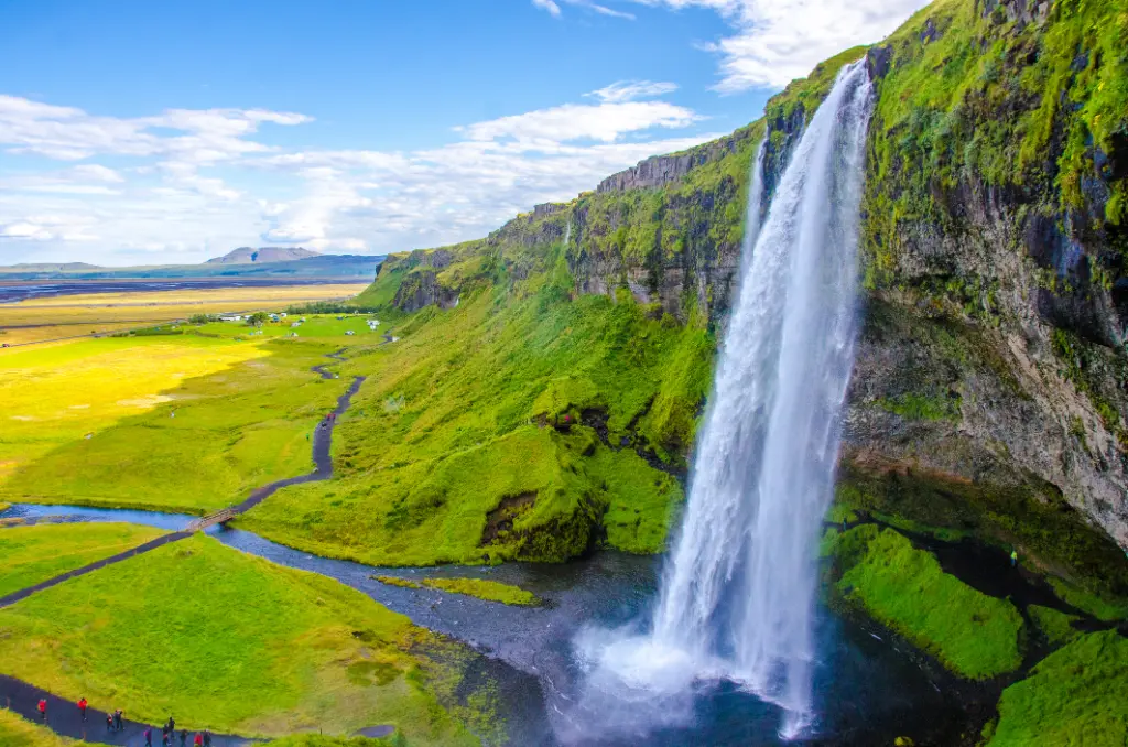Waterfall pours into the wide landscape
